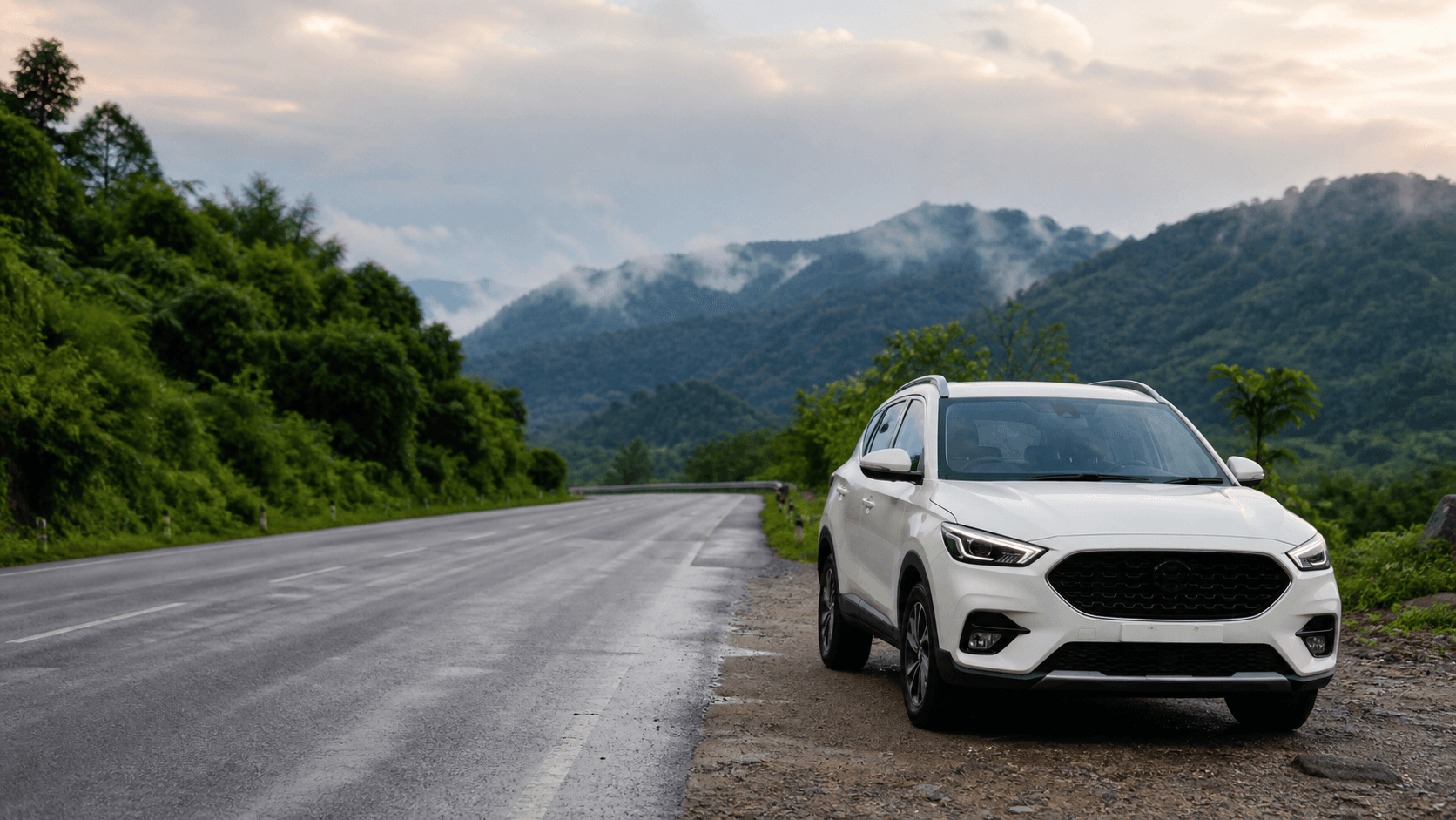 White rental car on a road from Siliguri towards the Himalayan foothills